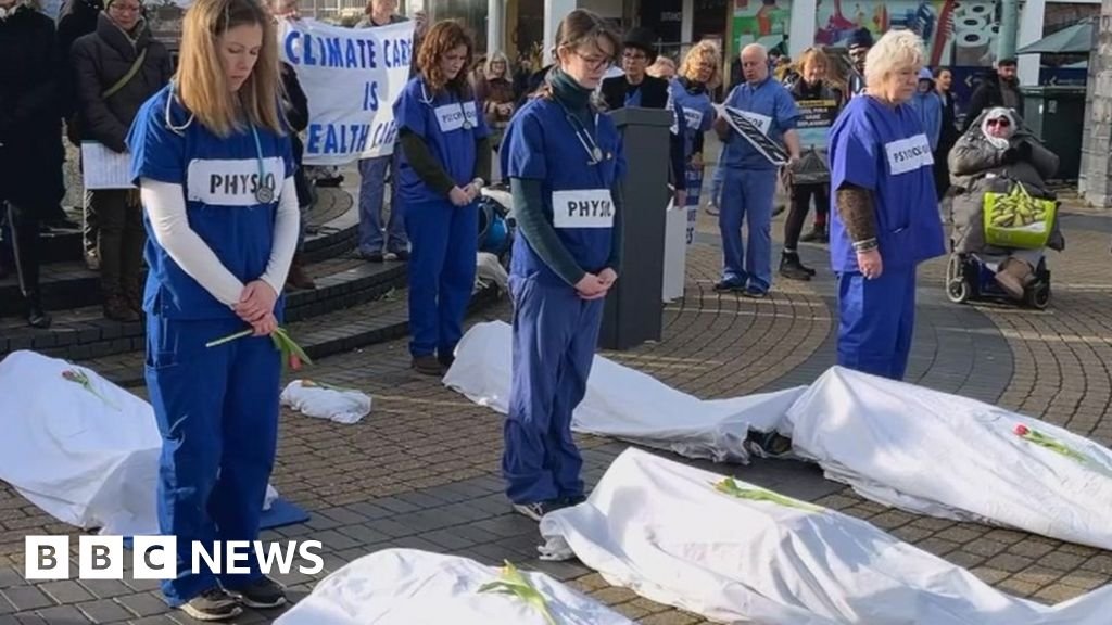 Medics take the lead in die-in protest against fossil fuels in Plymouth